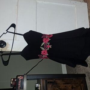 Black dress with beautiful pink rose around the waist